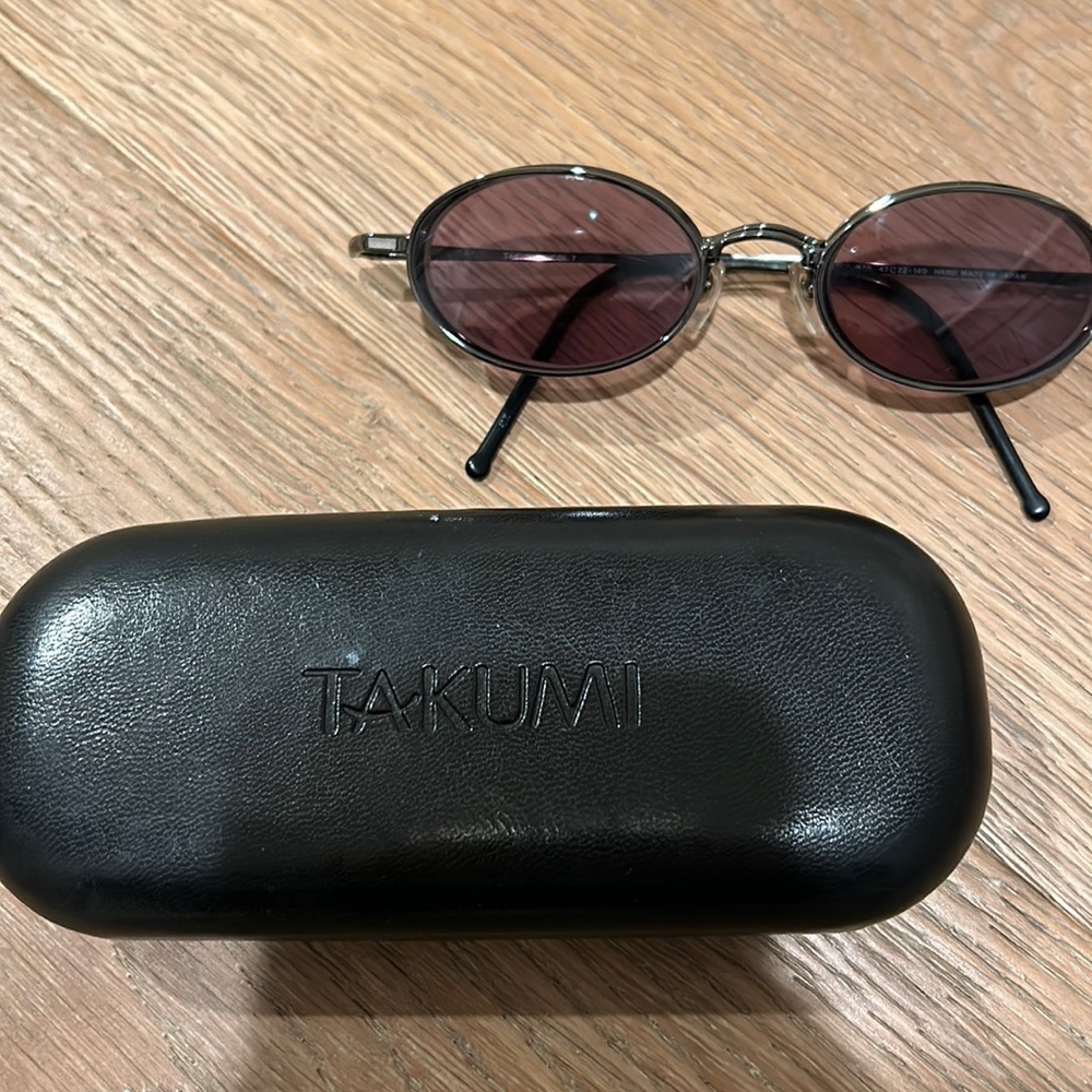 Takumi prescription glasses with magnetic clip on sunglasses.
